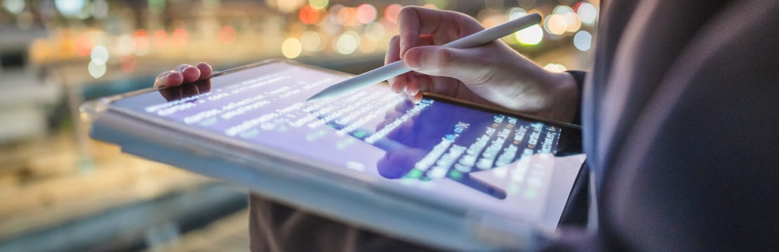 Modern generation Y business woman using Chatbot on tablet.